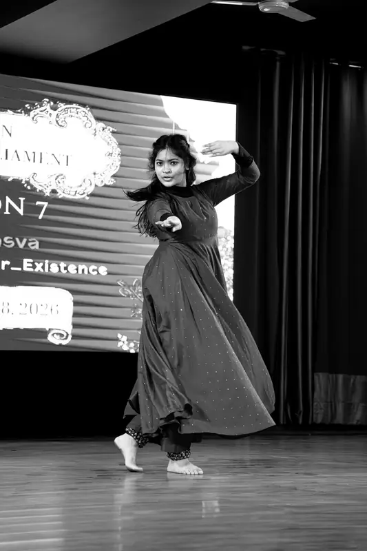 Black-and-white photo of the Kathak dancer mid-step