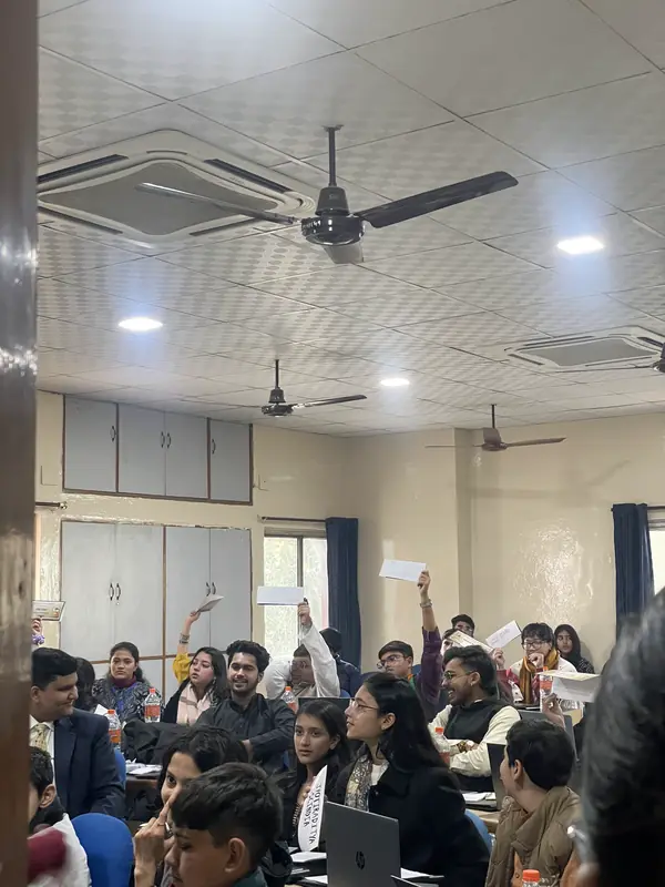 Delegates raising placards across a committee room