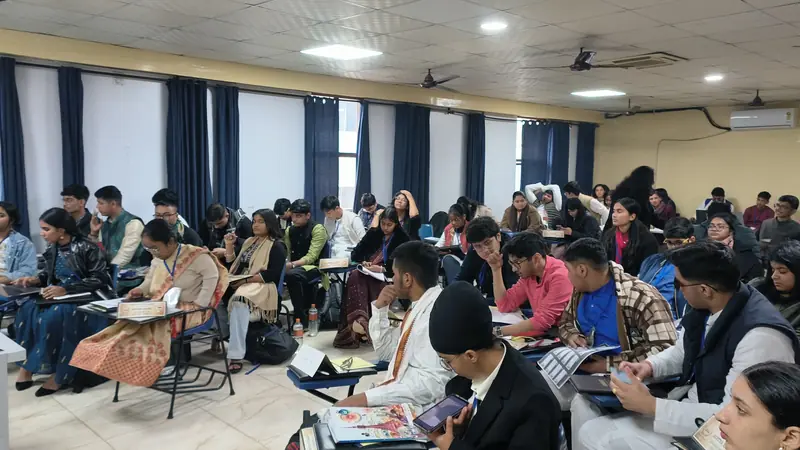 A large committee room full of delegates at their desks